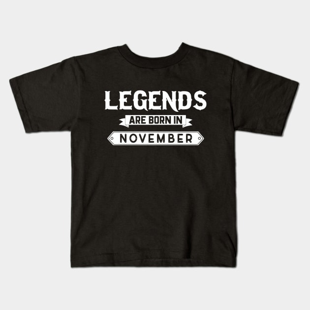 Legends Are Born In November Kids T-Shirt by inotyler